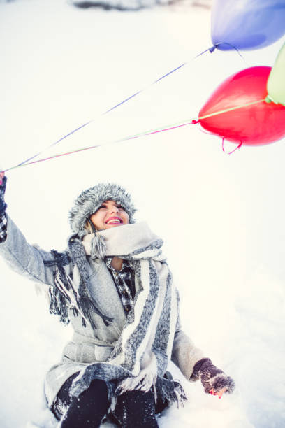 beauty girl in snow with ballons - balloon child winter snow imagens e fotografias de stock