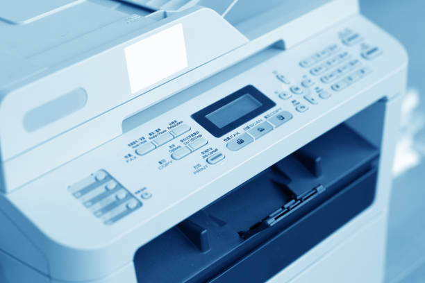 istock Man holding finger on start button of laser printer 835239662