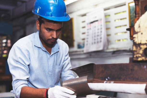 istock Engineer holding a piece of metal 835246546