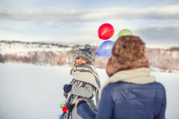 happy girls with balloons at winter day - balloon child winter snow imagens e fotografias de stock