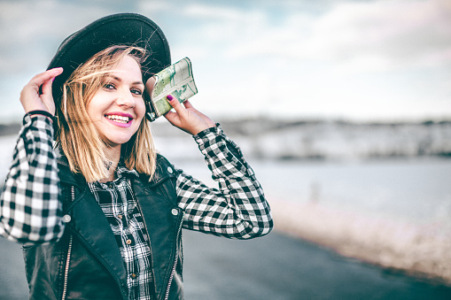 Hipster girl holding flask on the winter