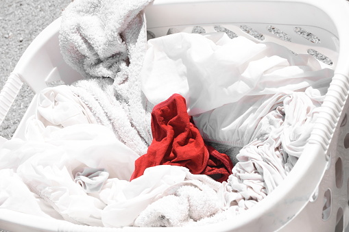 A red sock in a  White laundry