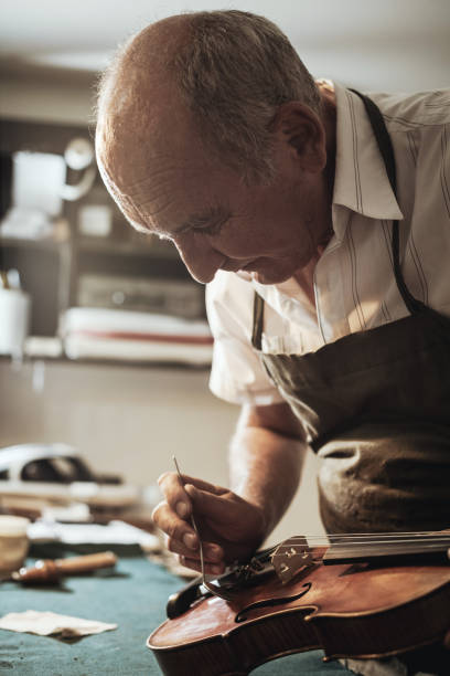 istock Senior entrepreneur working in instrument shop 835263118