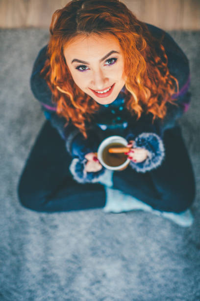 Smilling girl drink coffee
