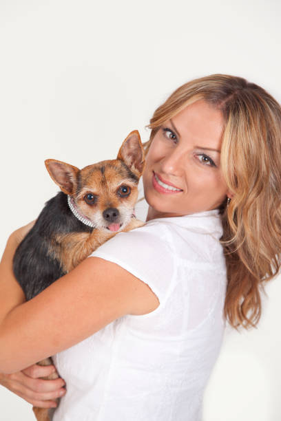 istock blonde woman with small dog 835269534