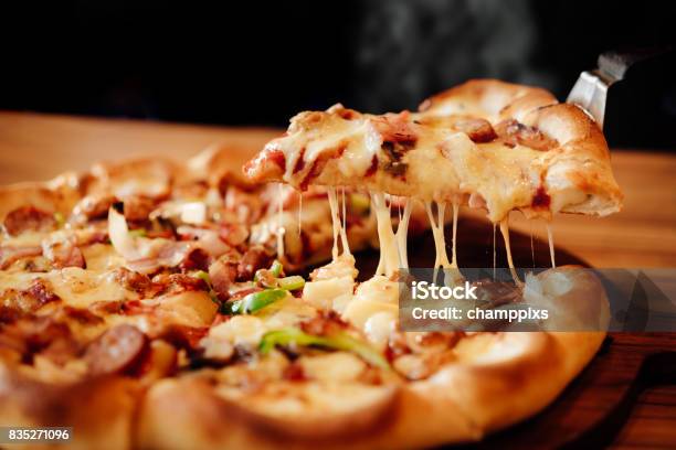 Slice Of Pizza Cheese Crust Seafood Topping Sauce With Bell Pepper Vegetables Delicious Tasty Fast Food Italian Traditional And Soft Drink Carbonated Fresh On Wooden Board Table Classic In Side View Stock Photo - Download Image Now