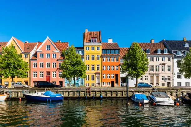 Colourful houses along canal in Downtown District of Copenhagen, Denmark.