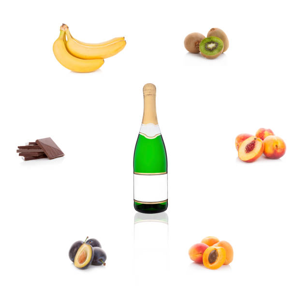 Champagne, sparkling wine with empty label with different fruits and chocolate isolated on white background. Aroma of wine. Wine bouguet.