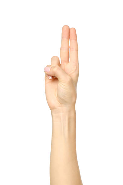 istock Woman's beautiful hand showing two fingers isolated on white 835288486