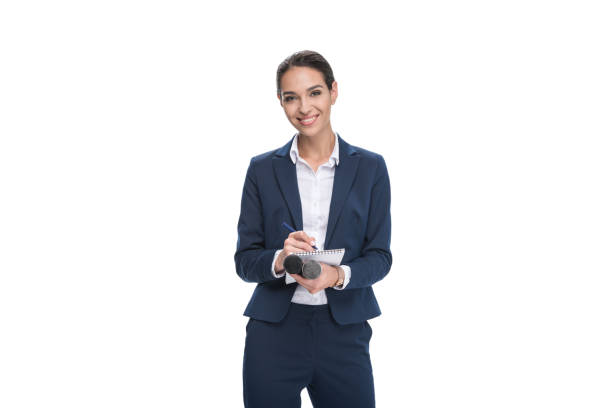 smiling female journalist in suit with microphone writing in notepad, isolated on white smiling female journalist in suit with microphone writing in notepad, isolated on white tv reporter photos stock pictures, royalty-free photos & images