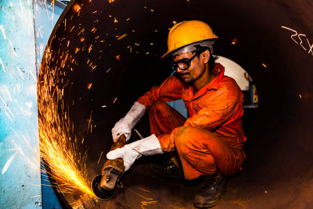 istock Grinder carefully smoothening the inside surface of a metal pipe 835293544