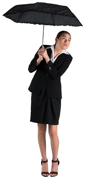 Young businesswoman holding umbrella on white background