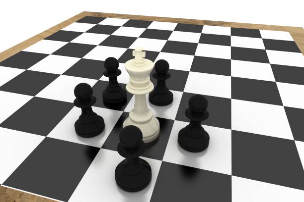 istock Black pawns surrounding white king 835309620