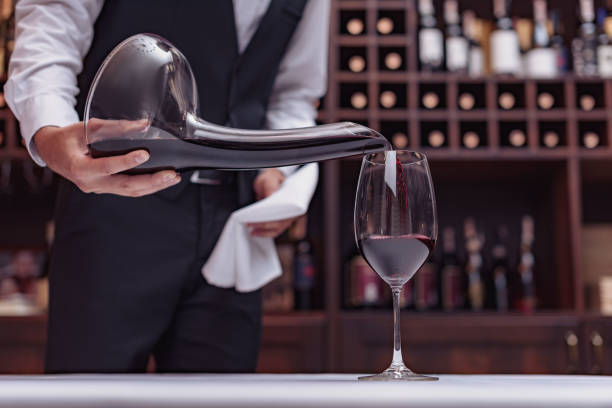 istock sommelier pouring red wine 835311622