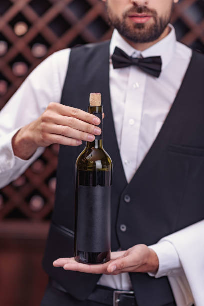istock sommelier with bottle of wine 835324644