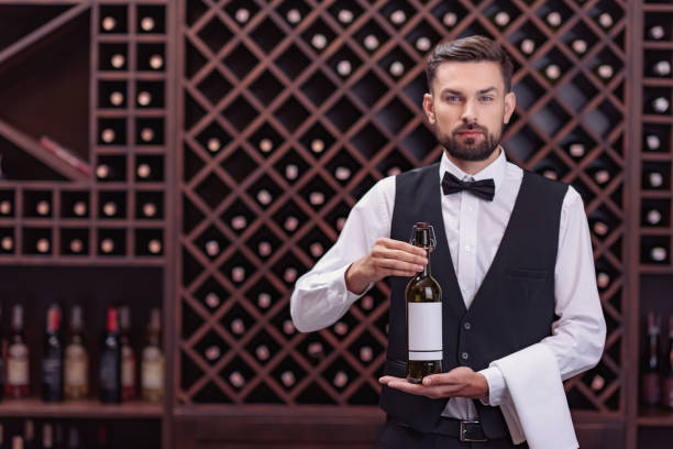 istock sommelier with bottle of wine 835324764