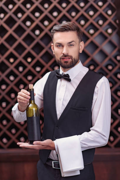 istock sommelier with bottle of wine 835325130