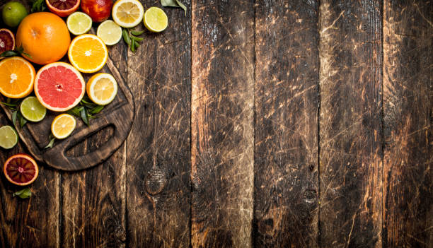 istock Citrus background. Fresh citrus fruit On a cutting Board. 835334452