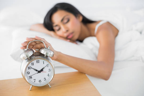 istock Attractive tired woman sleeping lying in her bed 835338182