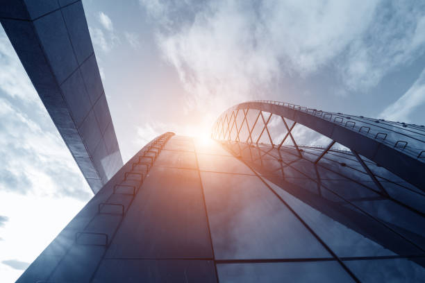 istock Bright outlook for business. Modern office block with sunny beautiful sky. 835350174
