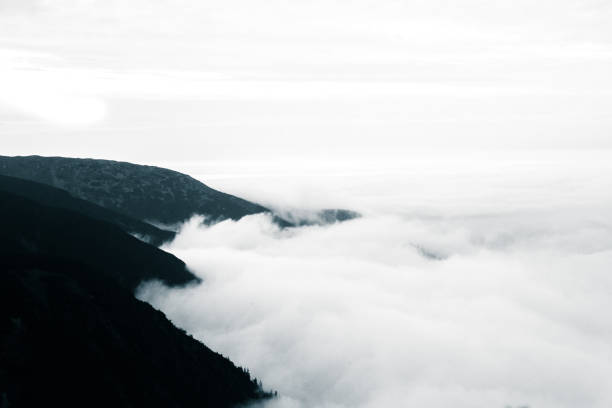 istock A beautiful monochromatic mountain view with rising clouds 835356288