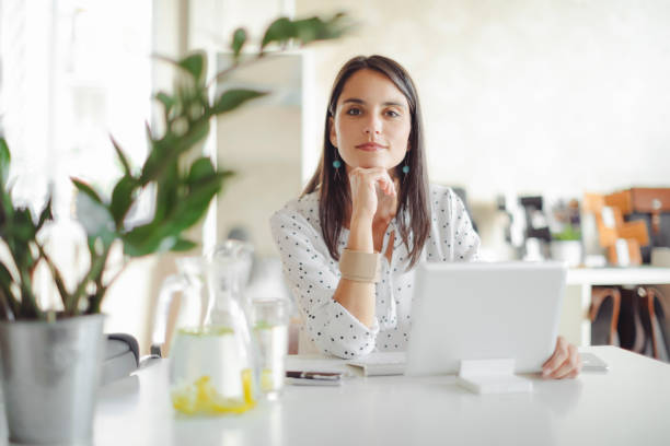 istock Young woman working in her offfice 835361618
