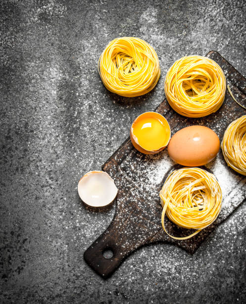 istock Pasta background. Cooking homemade pasta with egg and flour. 835365488