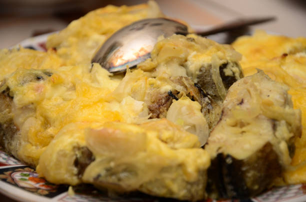 istock Fried fish with cheese sauce with spoon on plate 835376048