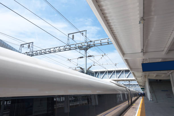 istock Modern high speed train at the railway station with motion blur effect 835377760