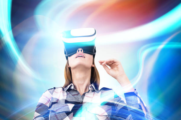 istock Girl in VR glasses looking up, abstract 835384090