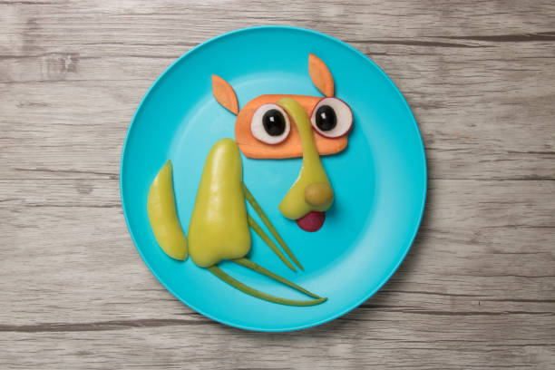 istock Wolf made of raw vegetables on plate and table 835385910