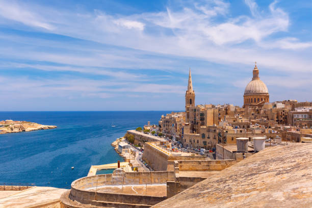 Domes and roofs of Valletta , Malta View from above of the domes of churches and roofs with church of Our Lady of Mount Carmel and St. Paul's Anglican Pro-Cathedral, Valletta, Capital city of Malta malta photos stock pictures, royalty-free photos & images