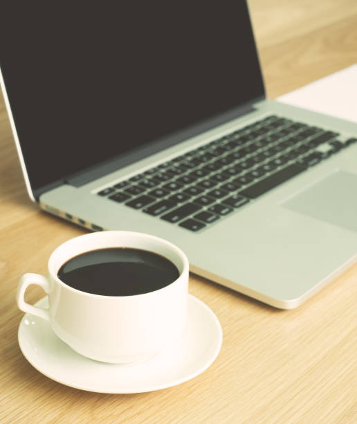 istock hot black coffee with laptop and white paper 835393848