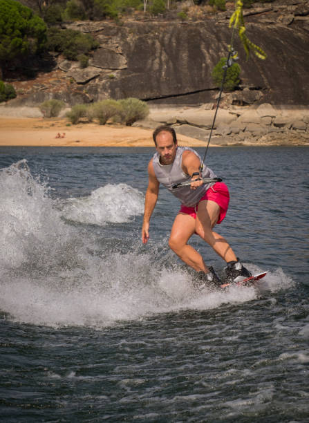 istock Funny wake-boarding sport on the lake 835394220