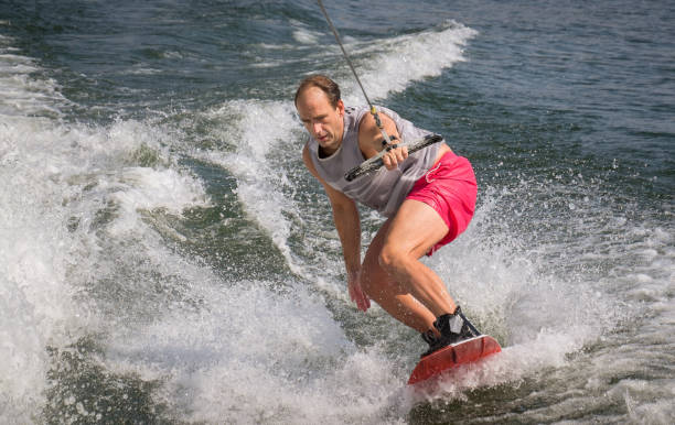 Funny wake-boarding sport on the lake stock photo