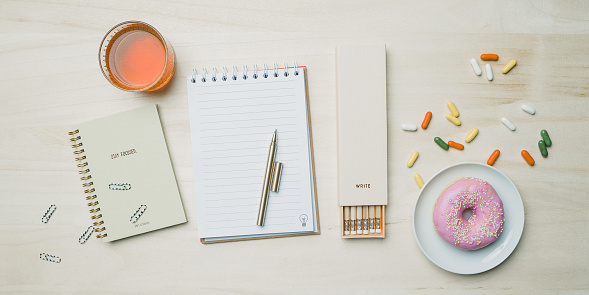 Stationery from above with notebook pencils