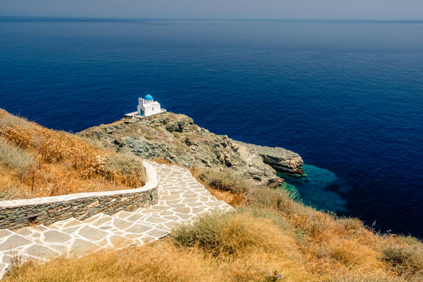 Aegean blue waters surround the  Chrisopigi Monastery Sifnos Greece