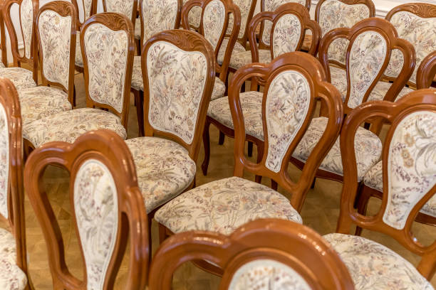 istock Rows of wooden chairs with fabric upholstery 835408690