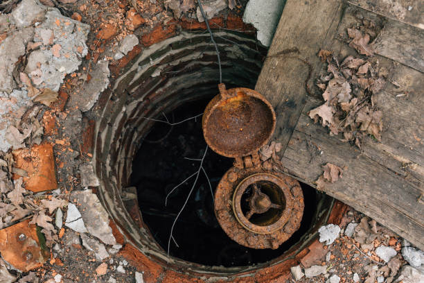 istock Old abandoned rusty water-supply brick mine, hatch, rusty water pipe 835414796