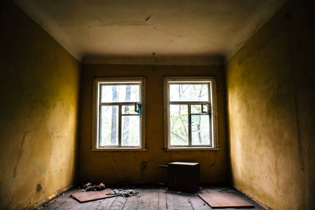 istock Room with two windows in abandoned ruined house 835415278