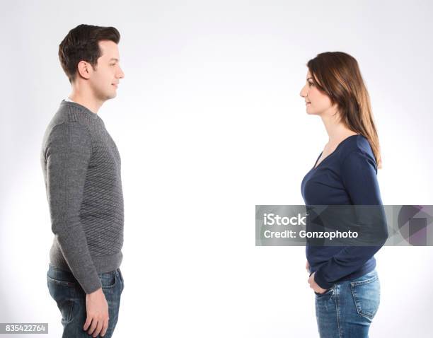 A Couple Looking To Each Other Stock Photo - Download Image Now - Face To Face, Two People, Men