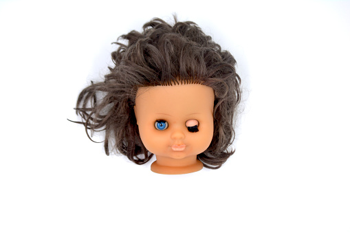 Doll head on a white background photo