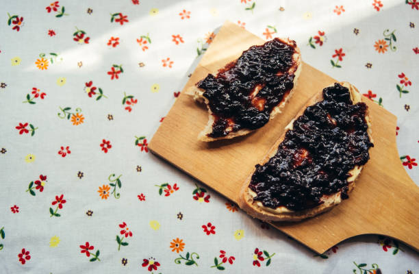 istock Two pieces of bread with plum jam 835453532