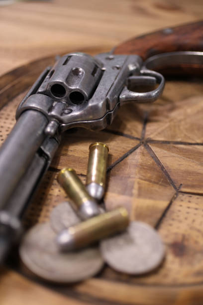 istock Western six shooter, bullets and coins 835459586
