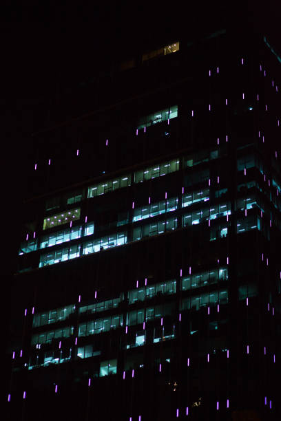 istock Illuminated windows of office building 835463306