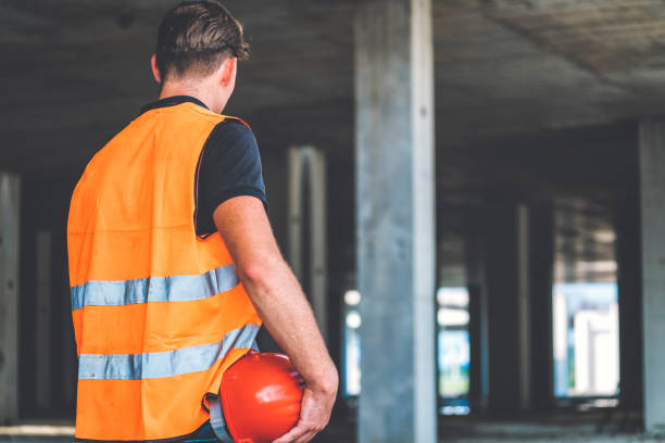 istock Rear view of a male engineer holding his hardhat 835468996