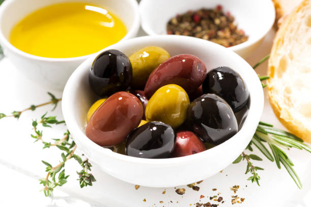 istock fresh organic olives, spices and bread, closeup 835478606