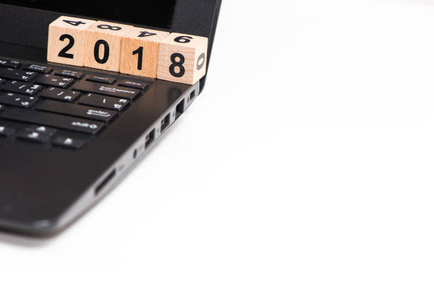 istock The wooden cube for new year on laptop and space 835483042
