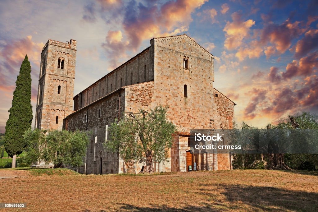Montalcino, Tuscany, Italy: medieval Abbey of Sant'Antimo Montalcino, Tuscany, Italy: Abbey of Sant'Antimo, the medieval catholic church in the province of Siena is a former Benedictine monastery. It is one of the most important architectures of the Tuscan Romanesque. Abbazia Di Sant'antimo Stock Photo