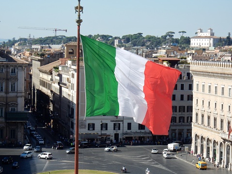 Rome, Lazio, Italy - July 18, 2017: Italian flag of the altar of Patria seen from the median terrace of the colonnade.\n